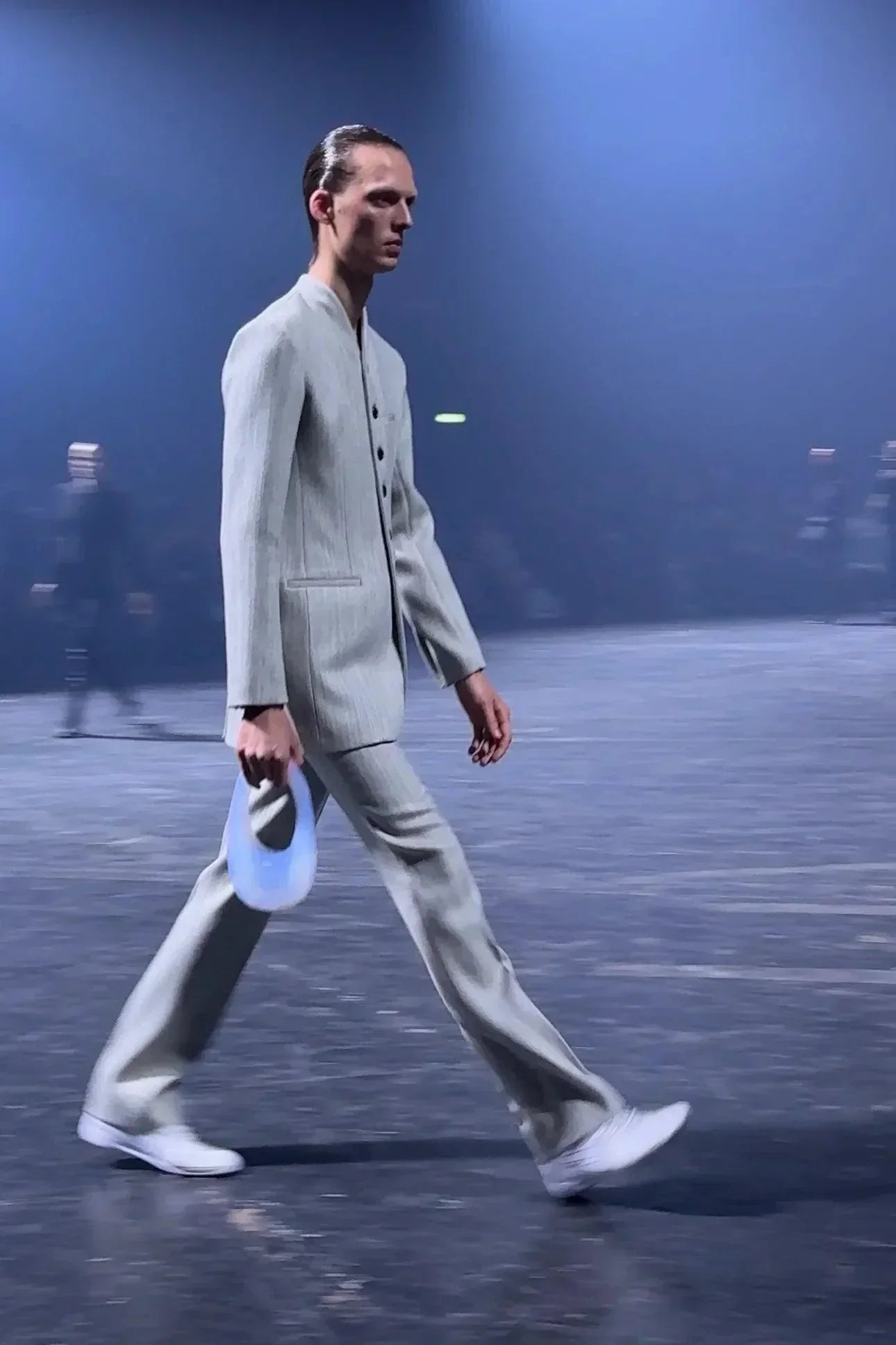 A model walking with coperni air swipe bag