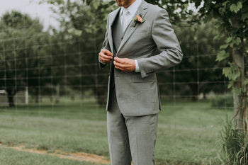 a man wearing a suit in his wedding
