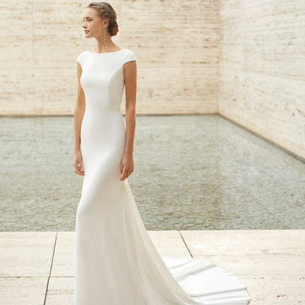 A bride wearing a designer wedding dress from Ellie Belle