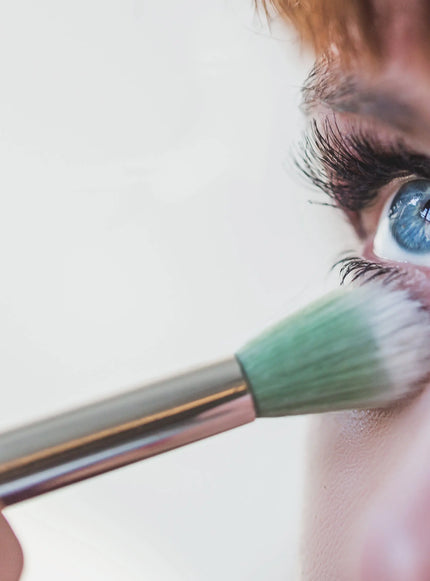 Model applying eye makeup
