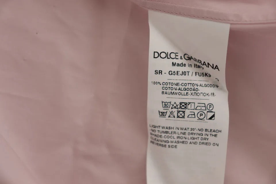 a label on the back of a pink shirt