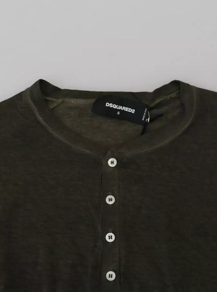 a black shirt with a white button on it