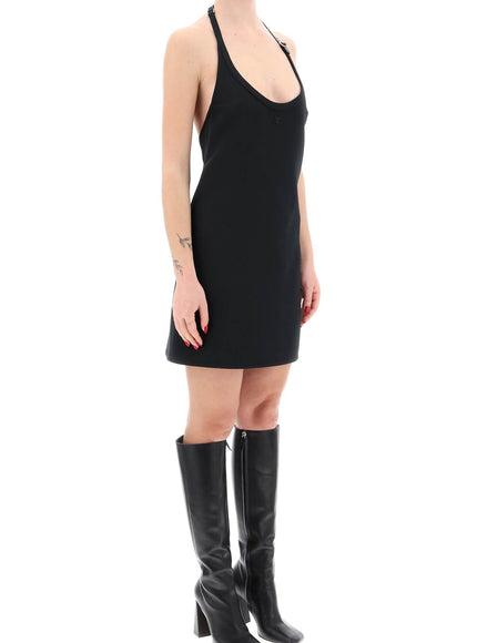 Courreges mini dress with strap and buckle detail.