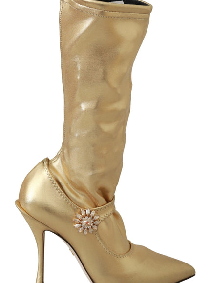 a gold high heeled shoe with a flower on the side