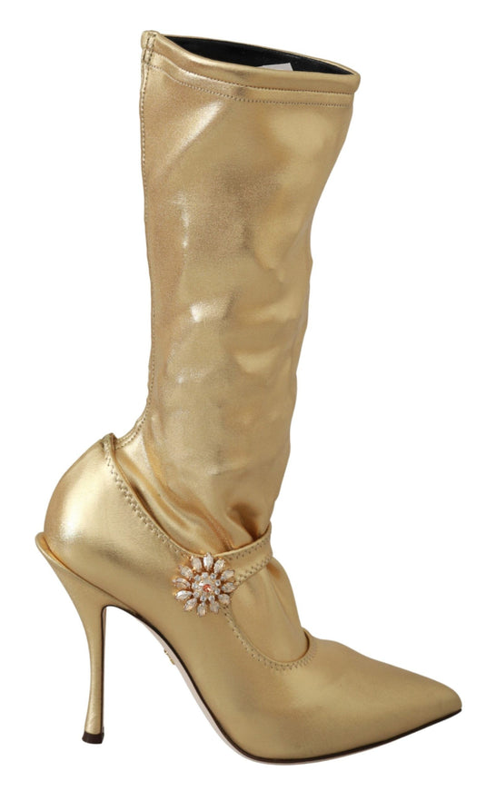 a gold high heeled shoe with a flower on the side