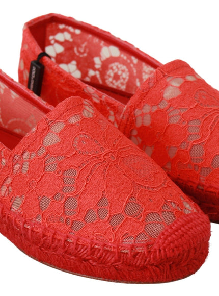 a pair of red shoes with lace on them