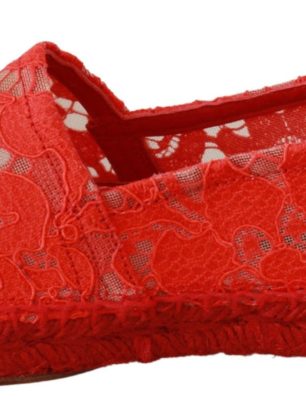 a pair of red shoes with lace on them