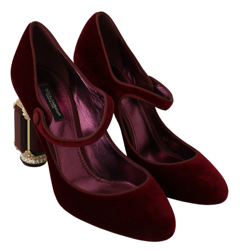 a pair of red high heels with a gold buckle