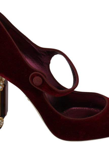 a pair of red high heels with a jeweled buckle