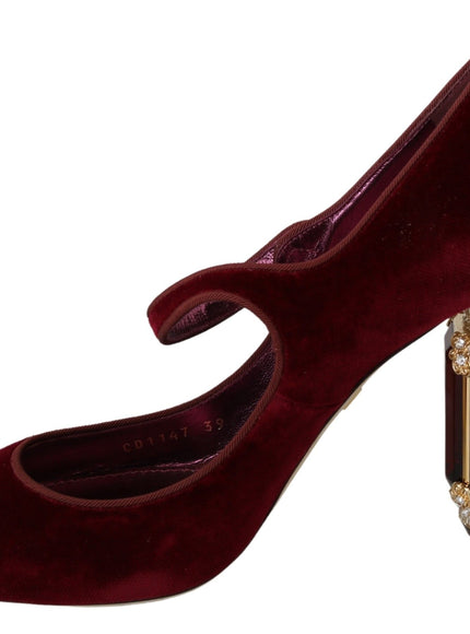 a pair of red high heels with a jeweled heel