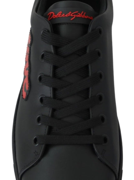 a black sneaker with red lettering on the side