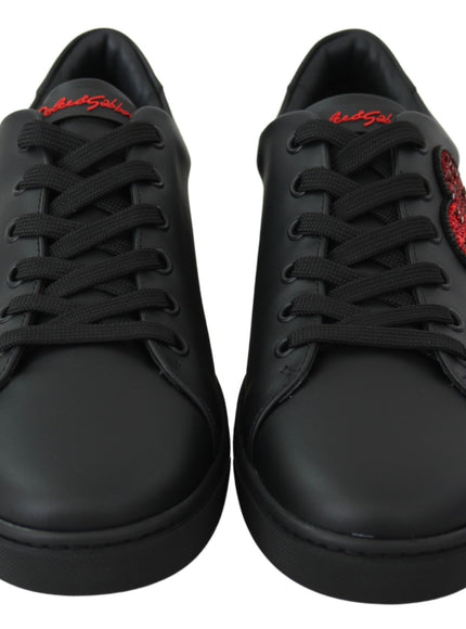 a pair of black sneakers with red laces