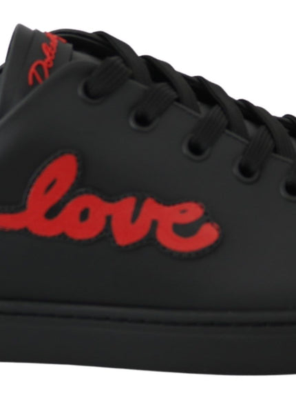 a pair of black and red sneakers with the word love on it