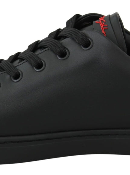 a black leather sneaker with a red logo on the side