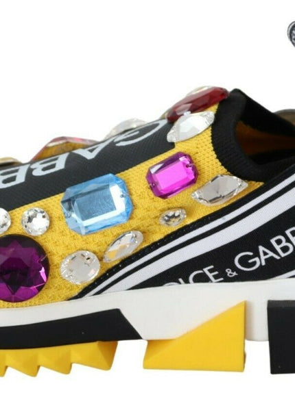 a pair of shoes with colorful stones on them