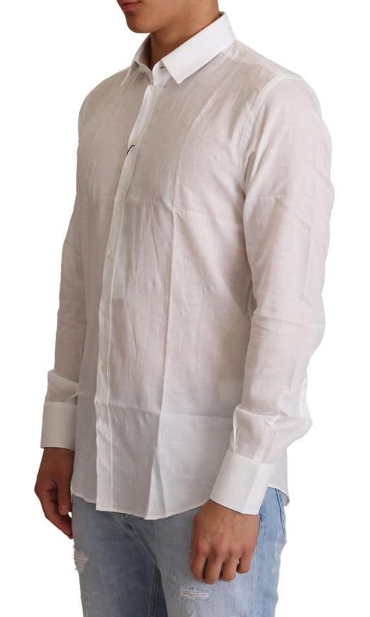 a man wearing a white shirt and jeans