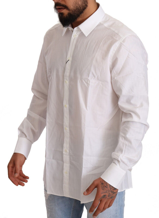 a man with a beard wearing a white shirt