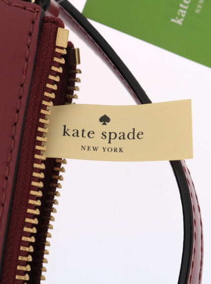 Kate Spade tag on Bordeaux leather crossbody