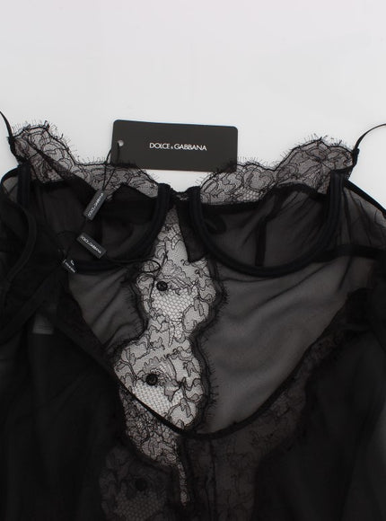 a black top with a lace neckline on a hanger