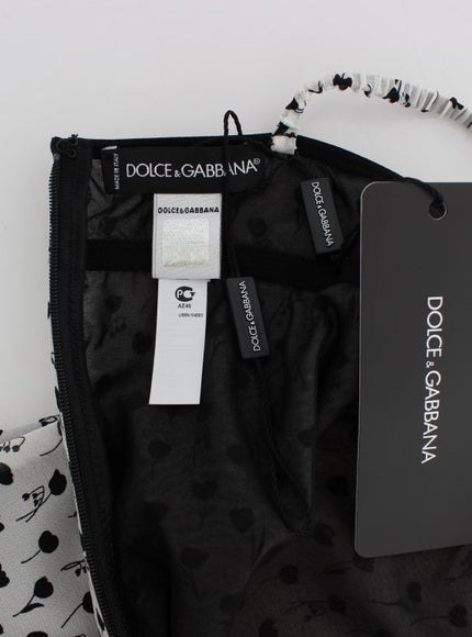 a black and white bag with a tag on it