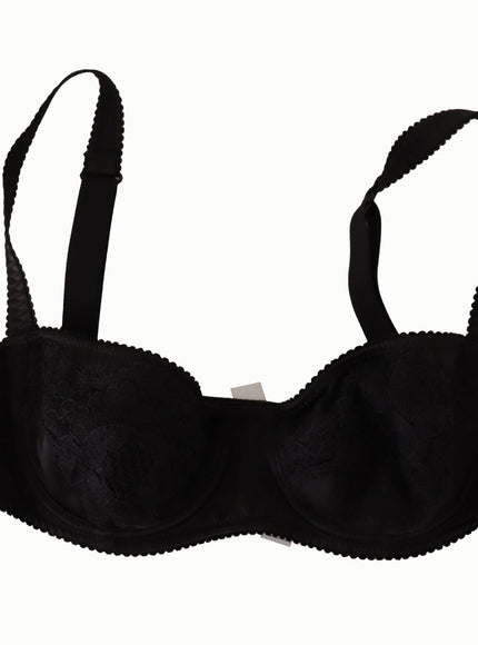 a black bra that has a black ribbon around it