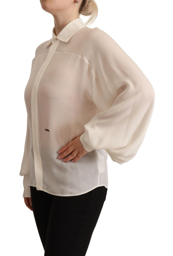 a woman wearing a white blouse and black pants