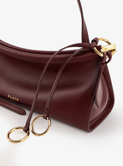 Alaia Le Click East West Small Leather Crossbody Bag