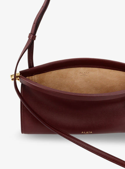 Alaia Le Click East West Small Leather Crossbody Bag