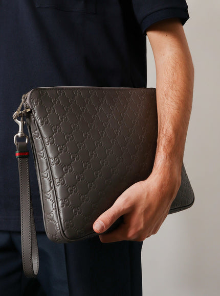 Gucci Leather Gg Emblem Crossbody Bag With Embossed Gg Motif