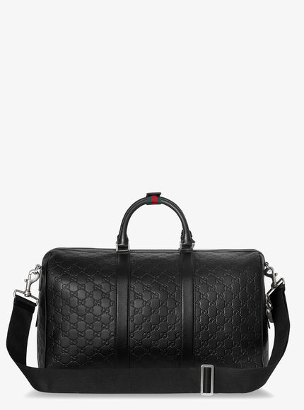 Gucci Coated Canvas Gg Emblem Travel Bag With Gg Motif
