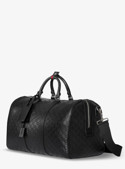 Gucci Coated Canvas Gg Emblem Travel Bag With Gg Motif
