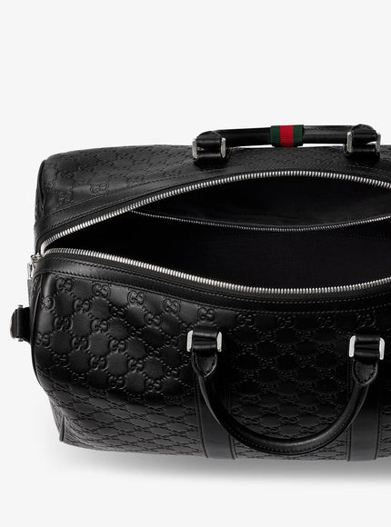 Gucci Coated Canvas Gg Emblem Travel Bag With Gg Motif