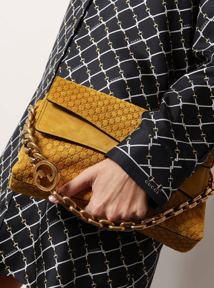 Gucci Leather Crossbody Bag With Embossed Gg Motif