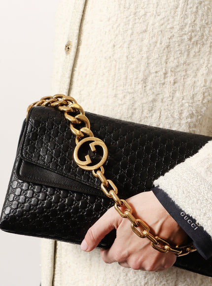 Gucci Leather Crossbody Bag With Embossed Gg Motif