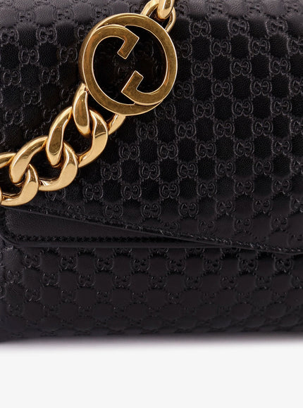 Gucci Leather Crossbody Bag With Embossed Gg Motif