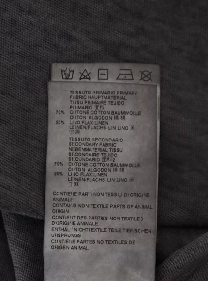 a label on the back of a gray shirt