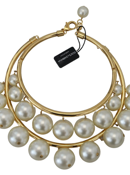 a necklace with pearls hanging from it