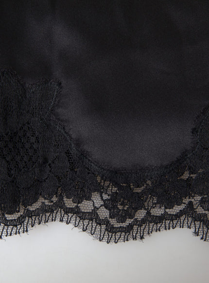 a close up of a black lace on a white surface