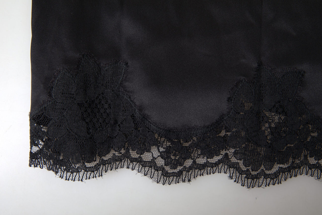 a close up of a black lace on a white surface