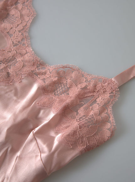 a piece of pink lingerie laying on top of a table