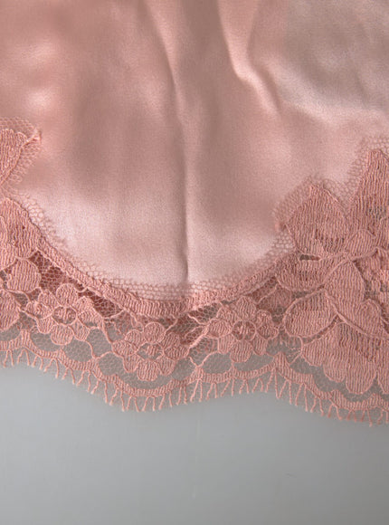 a piece of pink fabric with lace on it