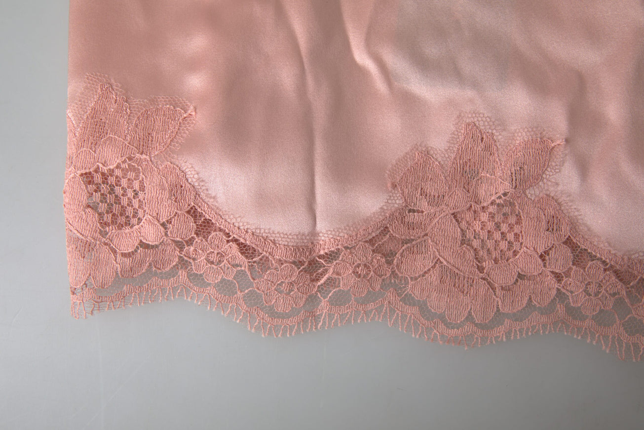 a piece of pink fabric with lace on it