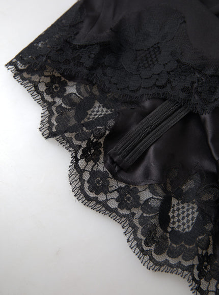 a piece of black lace on a white surface