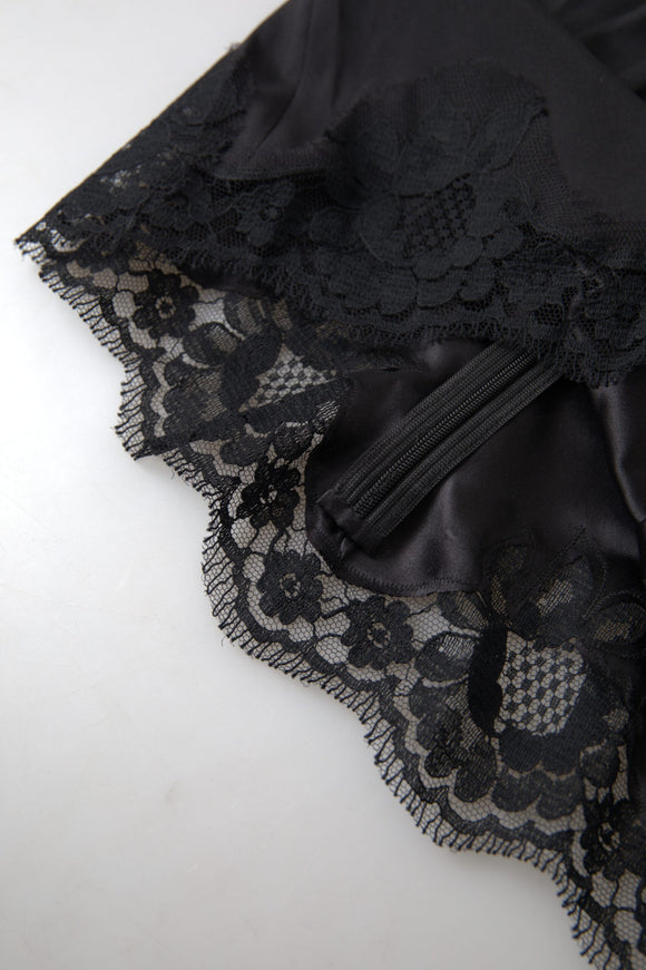 a piece of black lace on a white surface