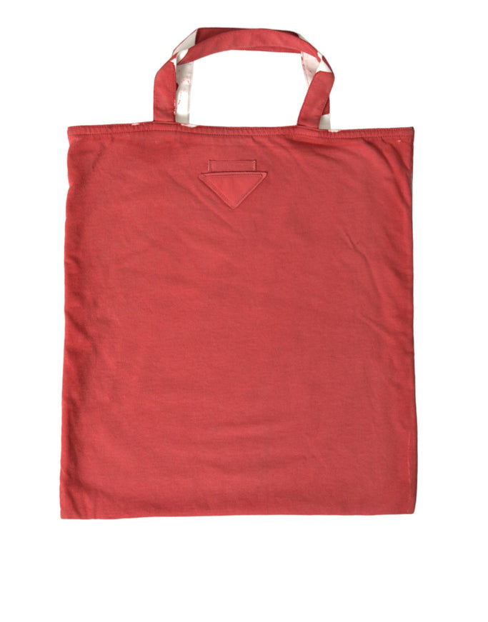 a red bag with a white handle on a white background