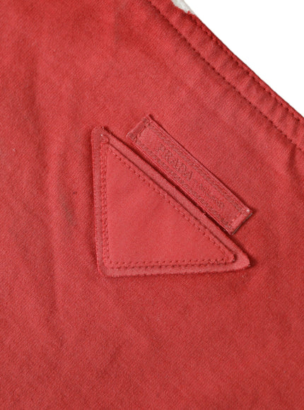 a close up of a red shirt with a patch on it