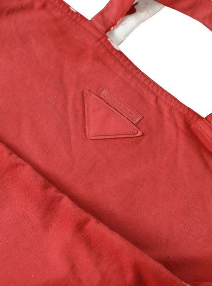 a close up of a red bag with a white background