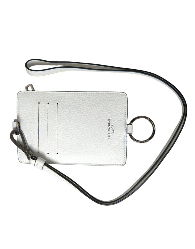 a white purse with a black strap on a white background