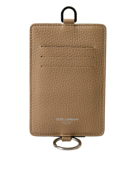 a tan card holder with a ring on it