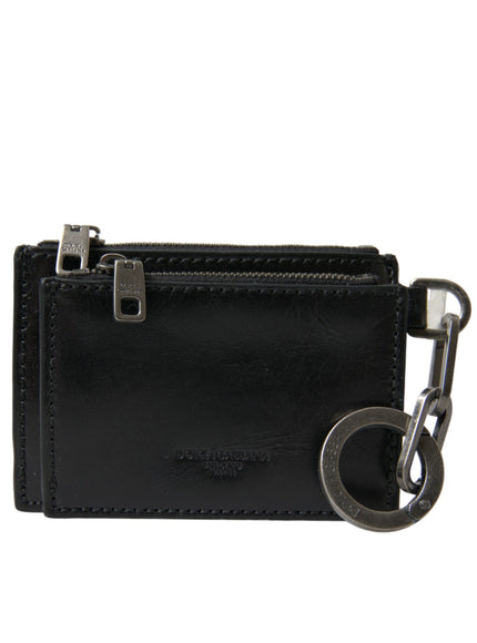 a black leather wallet with a metal keychain